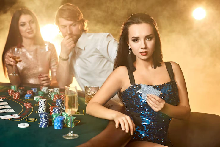 scatterna website image 295 showing group elegant people playing poker gambling house focus emotional brunette blue shiny dress passion cards chips alcohol dice gambling casino it is entertainment dange 639032 1709